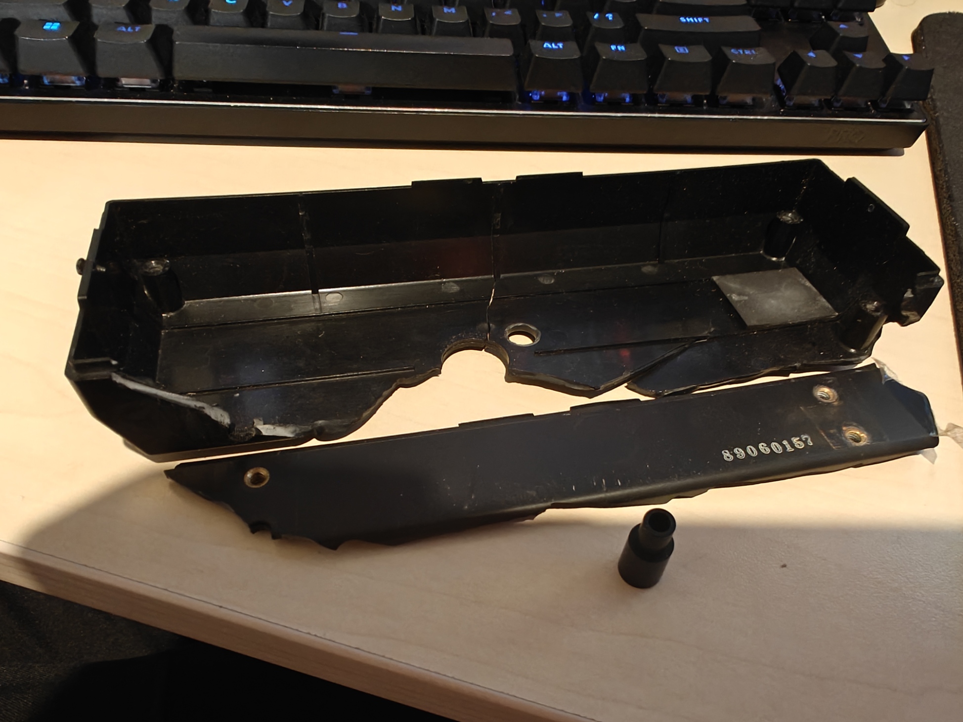 Severely broken Toyota LS2-AD320-202 sewing machine control panel plastic housing.