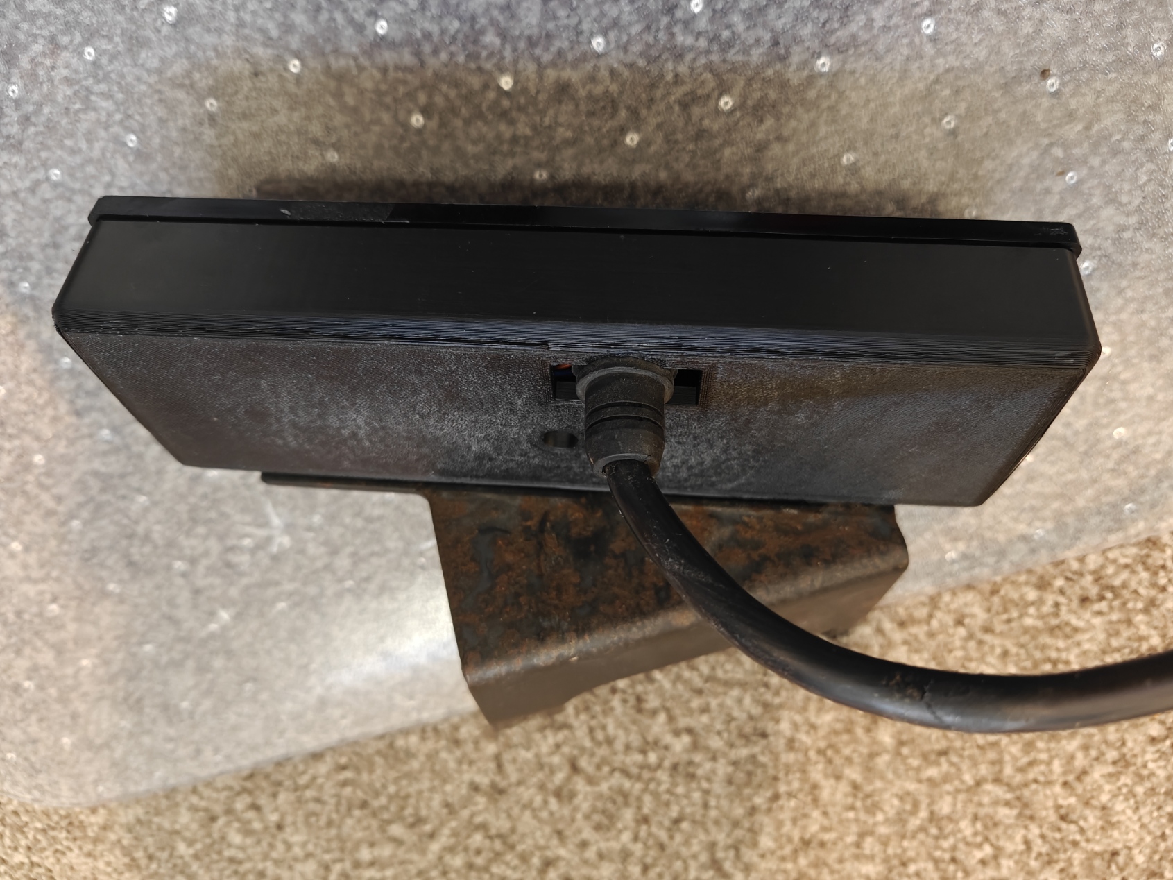 Rear view of Toyota LS2-AD320-202 control panel repaired housing installed with cable connected.