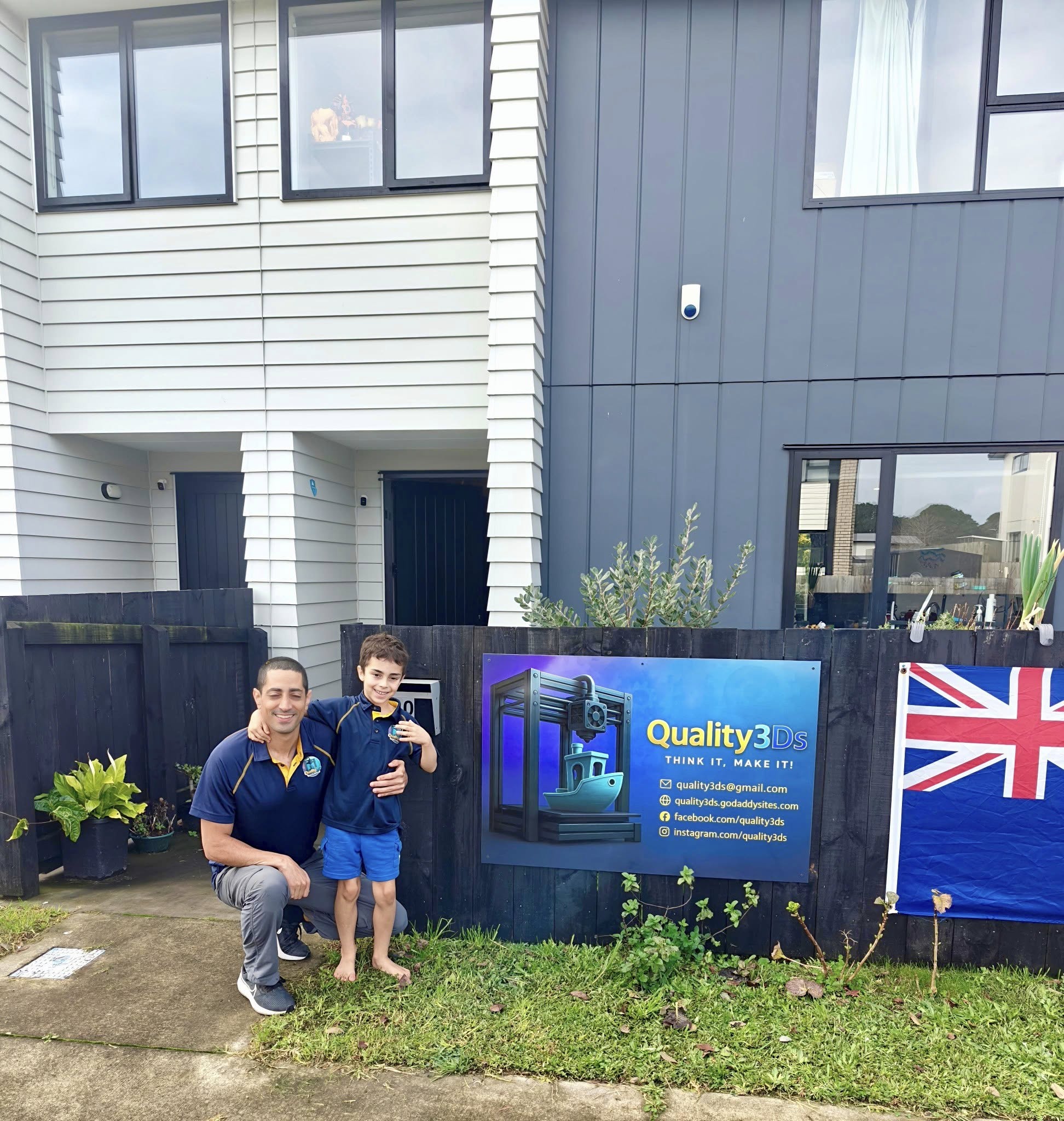 Quality3Ds founder and son at the workshop entrance in New Plymouth.
